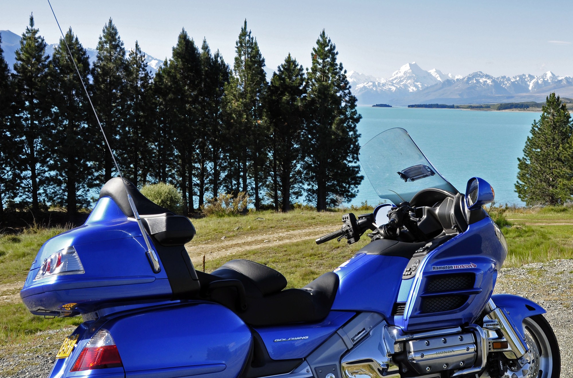 A photo stop beside Lake Pukaki, with Aoraki Mount Cook beyond.